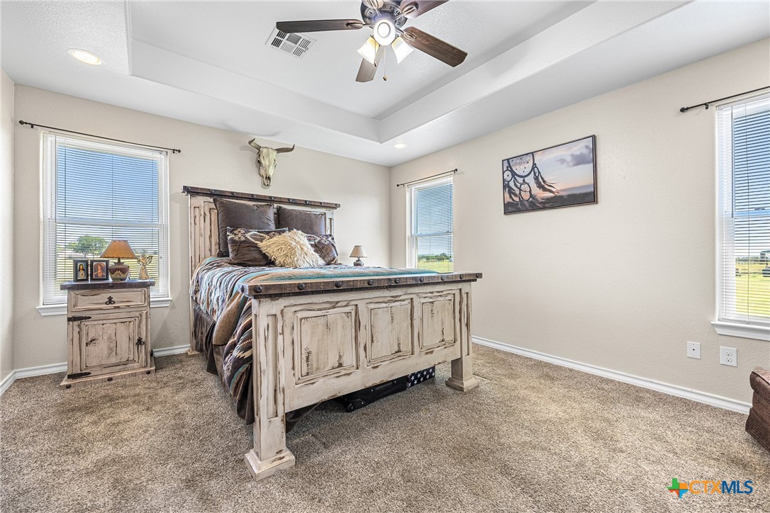 16101 Dove Road Moody, TX 76557 - Photo 19 of 42 a bedroom with a bed and a chandelier