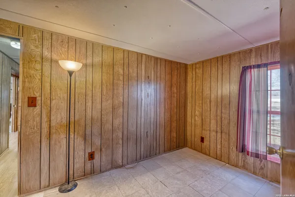 a view of a bathroom with shower and window