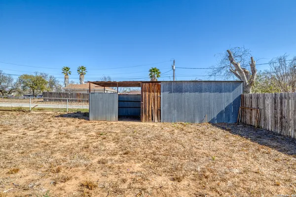 a view of a backyard of the house