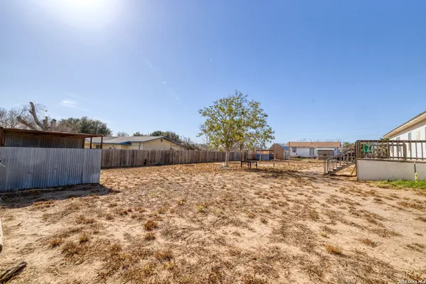 a view of a backyard of a house