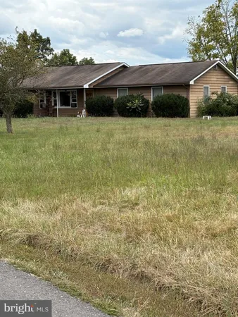 a front view of a house with yard