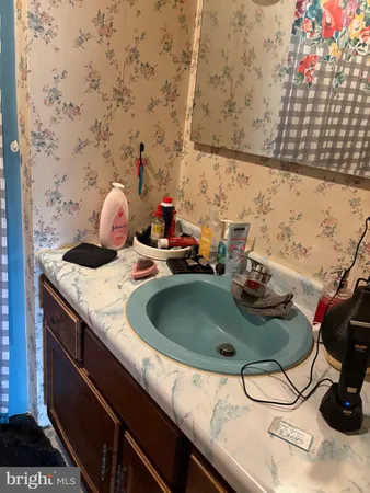 a bathroom with a sink and vanity