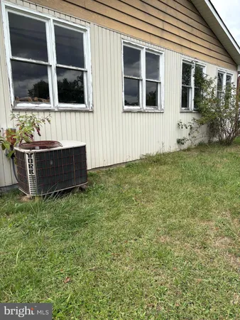 a view of house with backyard