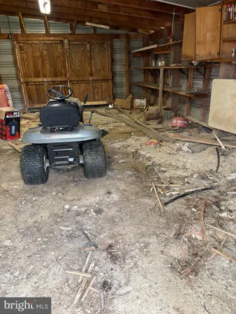 a kitchen with a stove and a wooden floor