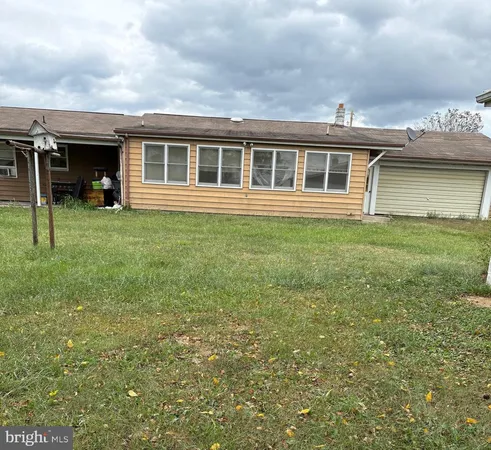 a view of house with yard