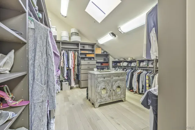 an aerial view of residential houses with outdoor space and a lake view