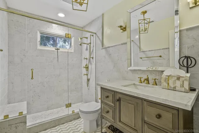 a view of a bench in a backyard of a house