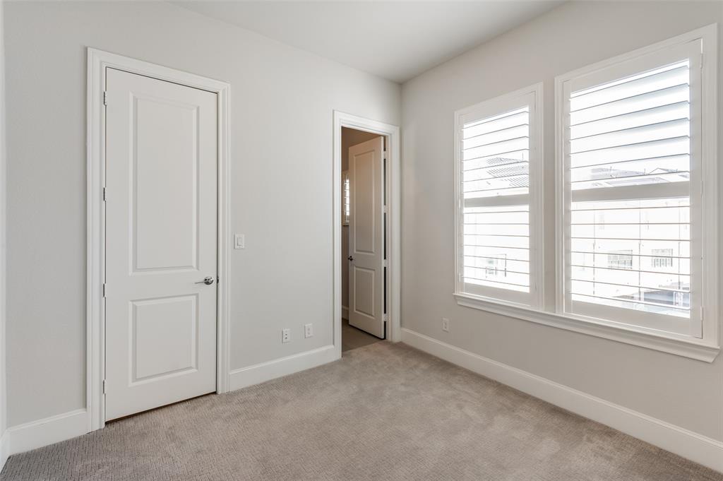 5421 Patterson Street Irving, TX 75039 - Photo 25 of 32 Neutral tone wall paint complements the plush carpet flooring