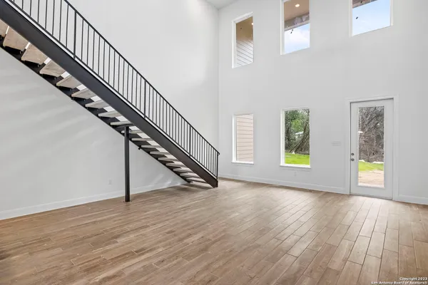 a view of an entryway with wooden floor