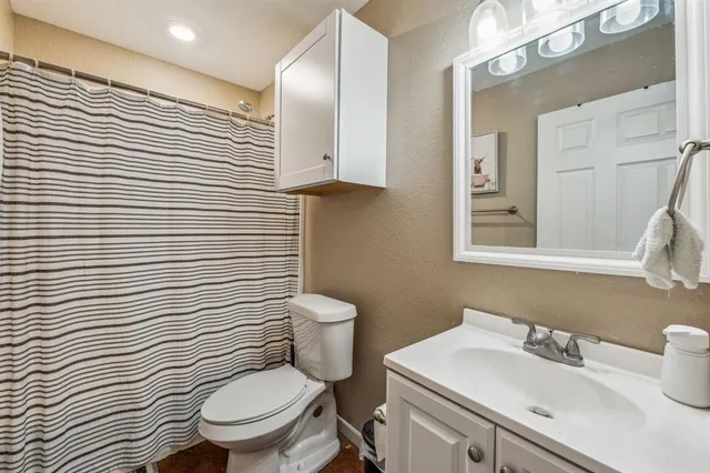 a kitchen with granite countertop stainless steel appliances a sink and a window