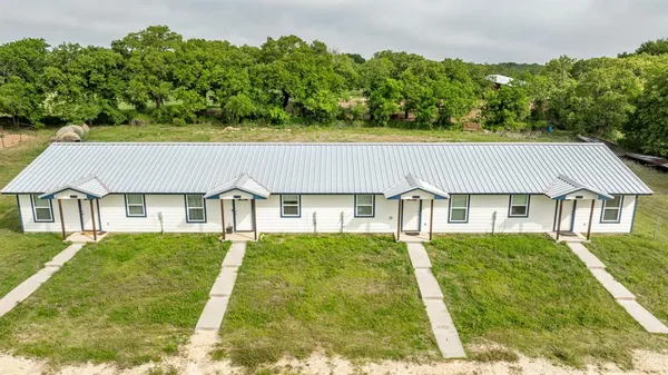 a view of a livingroom with furniture and window