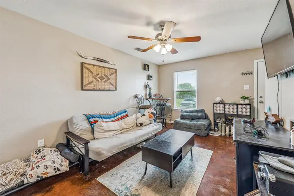 a bedroom with bed and a window