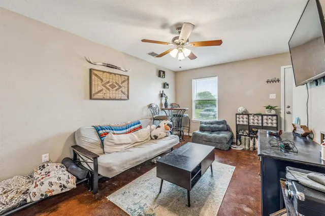 a bedroom with bed and a window