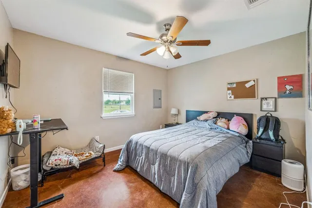 a kitchen with a sink a refrigerator and cabinets