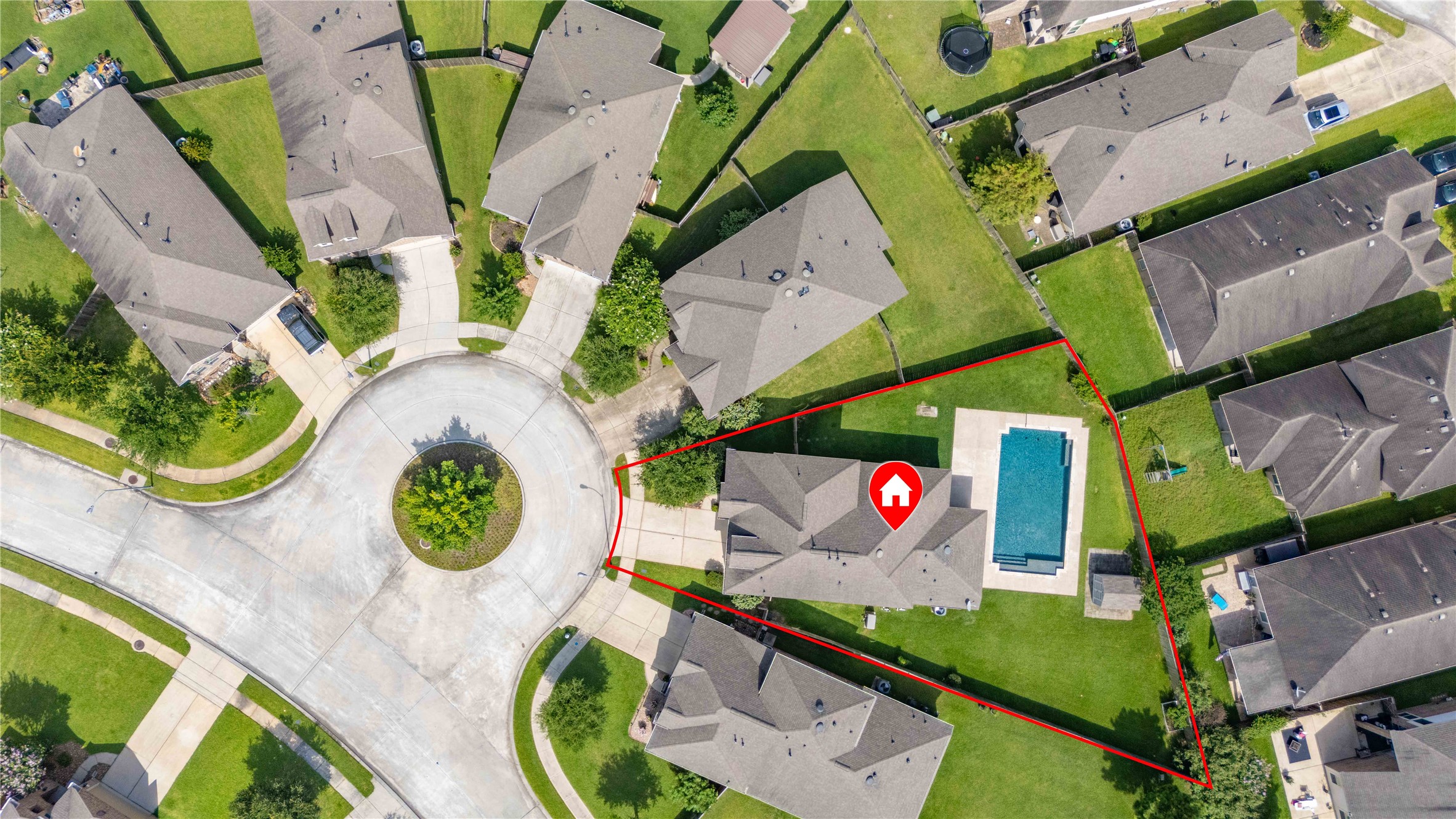 17206 Upper Ridge Lane Humble, TX 77346 - Photo 1 of 50 A spacious property located in a cul-de-sac, featuring a sizable backyard with a swimming pool. The home is well-positioned with ample green space, offering privacy and a welcoming neighborhood setting.