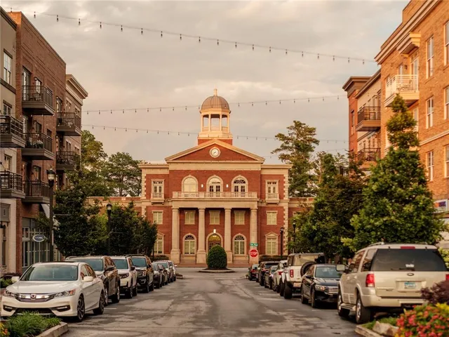 a front view of a building with parking space