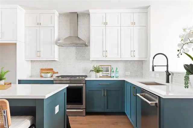 a kitchen with a sink cabinets and appliances