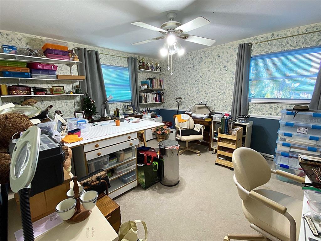 626 Orchid Lane Altamonte Springs, FL 32714 - Photo 16 of 24 a view of a workspace with furniture and a window