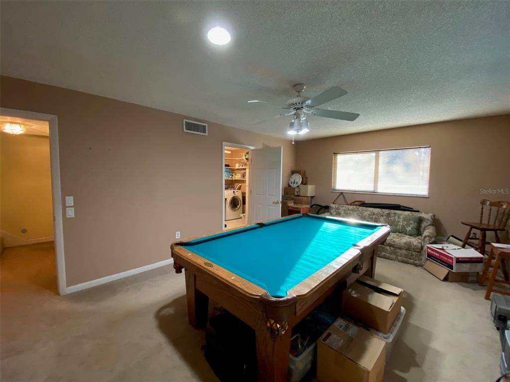 626 Orchid Lane Altamonte Springs, FL 32714 - Photo 21 of 24 a room with pool table and a ceiling fan
