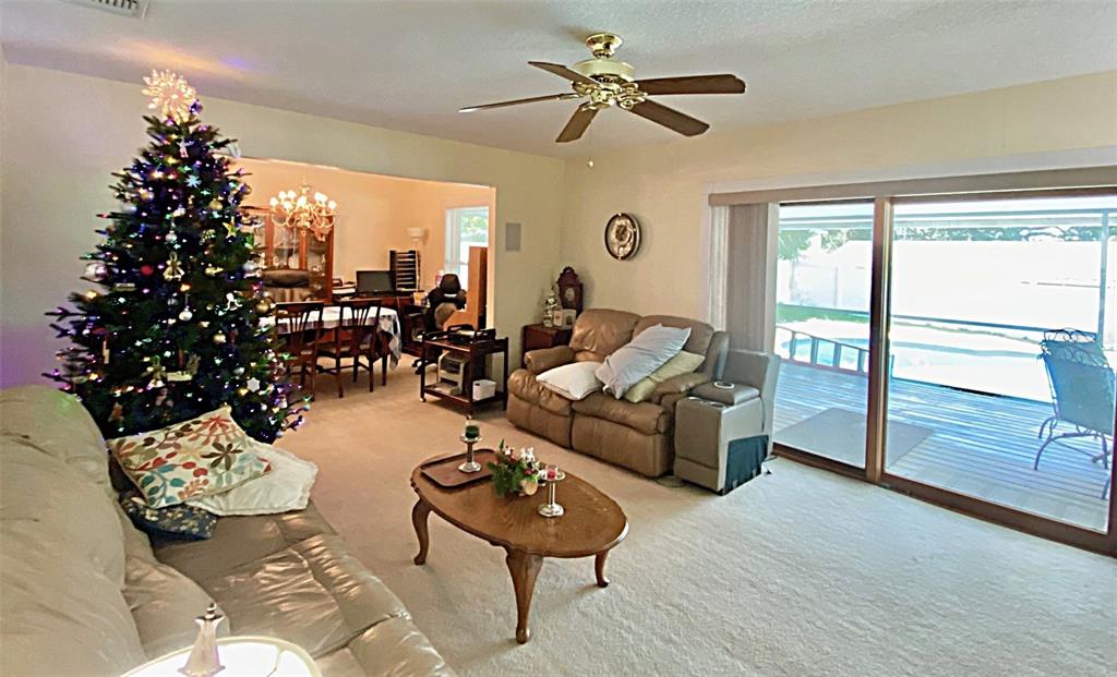 626 Orchid Lane Altamonte Springs, FL 32714 - Photo 6 of 24 a living room with patio furniture and a large window