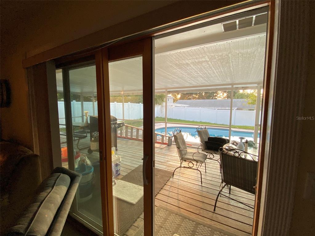 626 Orchid Lane Altamonte Springs, FL 32714 - Photo 7 of 24 a view of a room with wooden floor and furniture