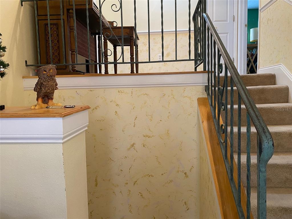 626 Orchid Lane Altamonte Springs, FL 32714 - Photo 9 of 24 a view of staircase with wooden floor and windows