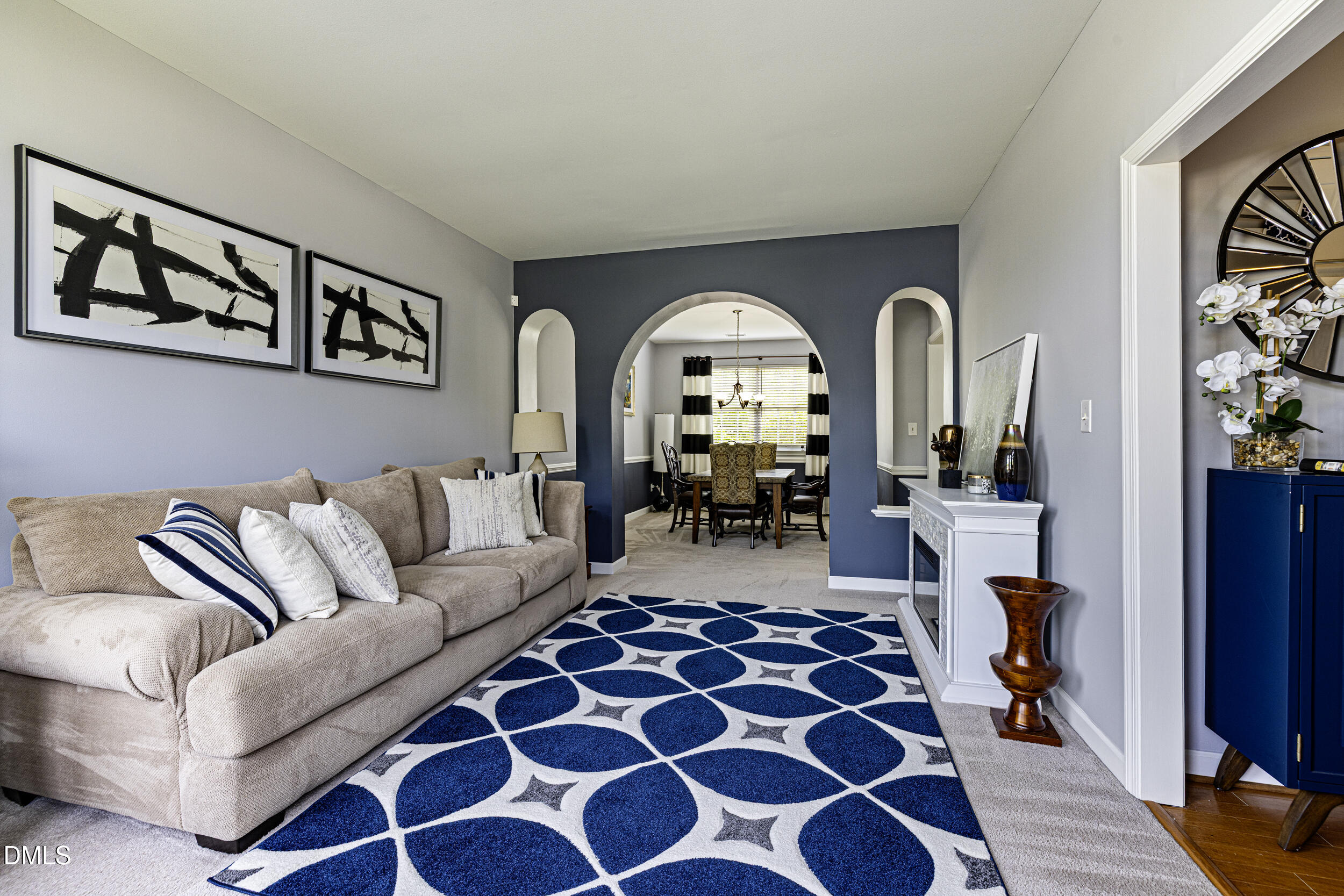 2208 Water Spray Drive Raleigh, NC 27610 - Photo 11 of 28 a living room with furniture and a large window