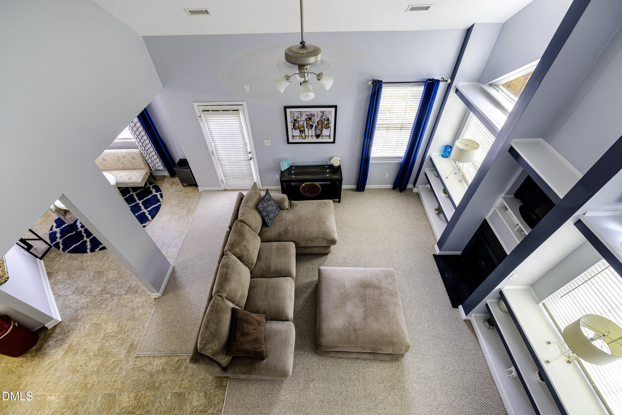 2208 Water Spray Drive Raleigh, NC 27610 - Photo 15 of 28 a living room with furniture and a flat screen tv