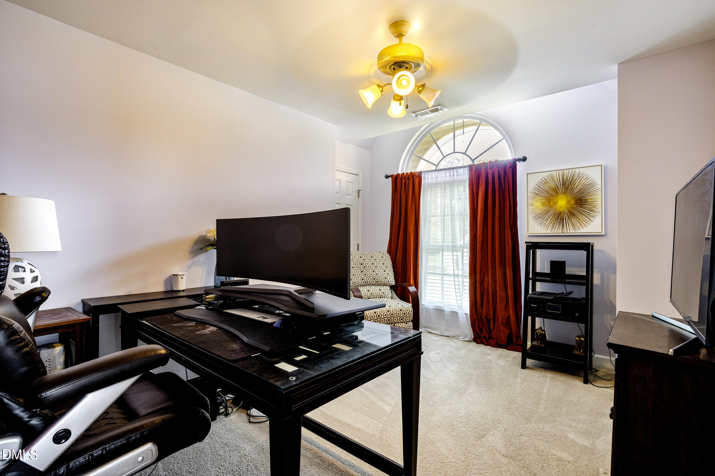 2208 Water Spray Drive Raleigh, NC 27610 - Photo 16 of 28 a bedroom with a bed and a chandelier