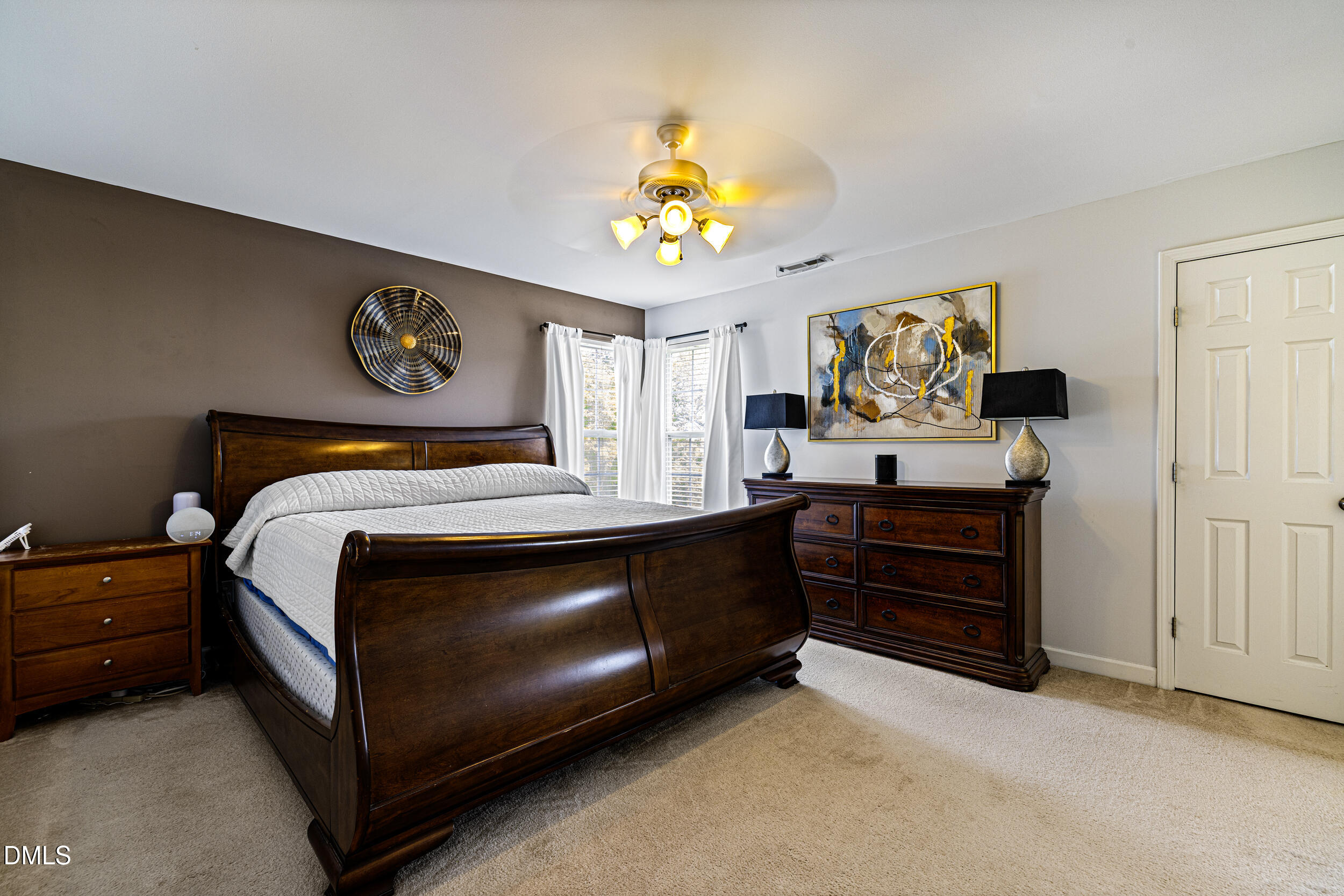 2208 Water Spray Drive Raleigh, NC 27610 - Photo 18 of 28 a bedroom with a bed and furniture