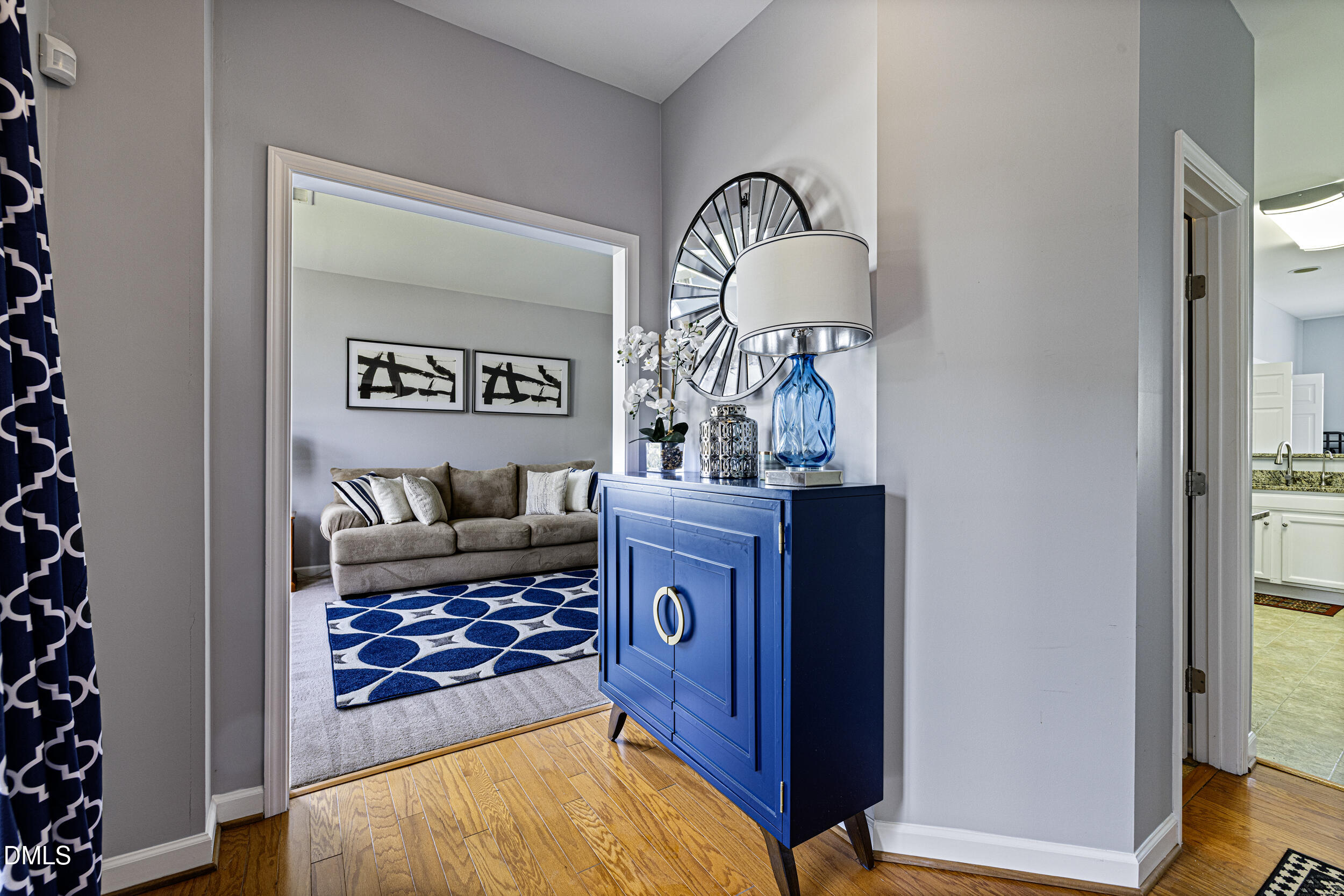 2208 Water Spray Drive Raleigh, NC 27610 - Photo 2 of 28 a living room with furniture and a mirror
