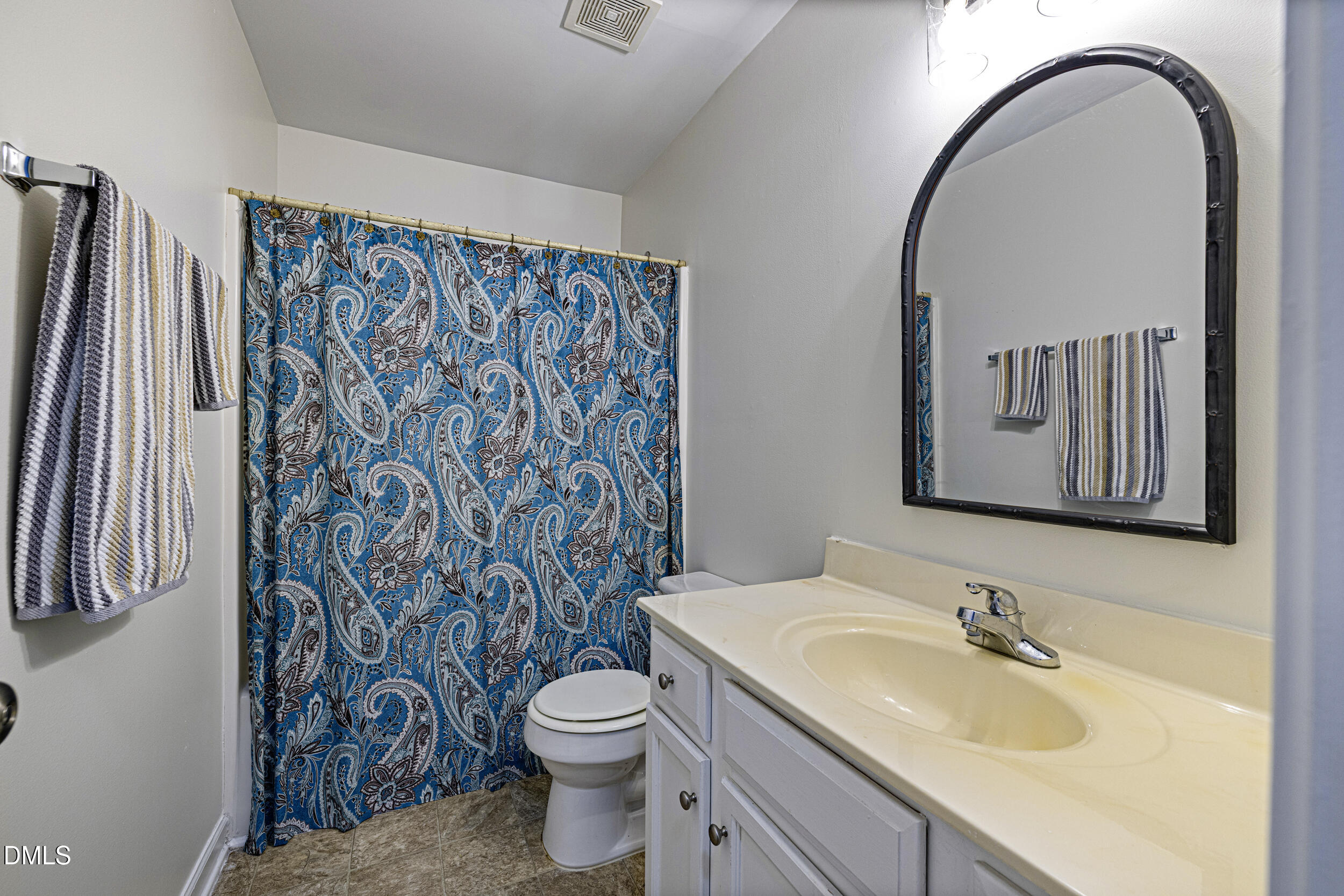 2208 Water Spray Drive Raleigh, NC 27610 - Photo 22 of 28 a bathroom with a granite countertop sink and a toilet