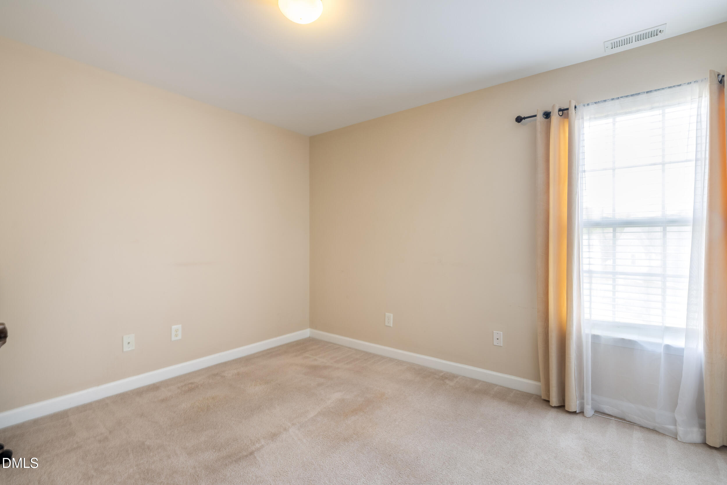2208 Water Spray Drive Raleigh, NC 27610 - Photo 23 of 28 an empty room with windows