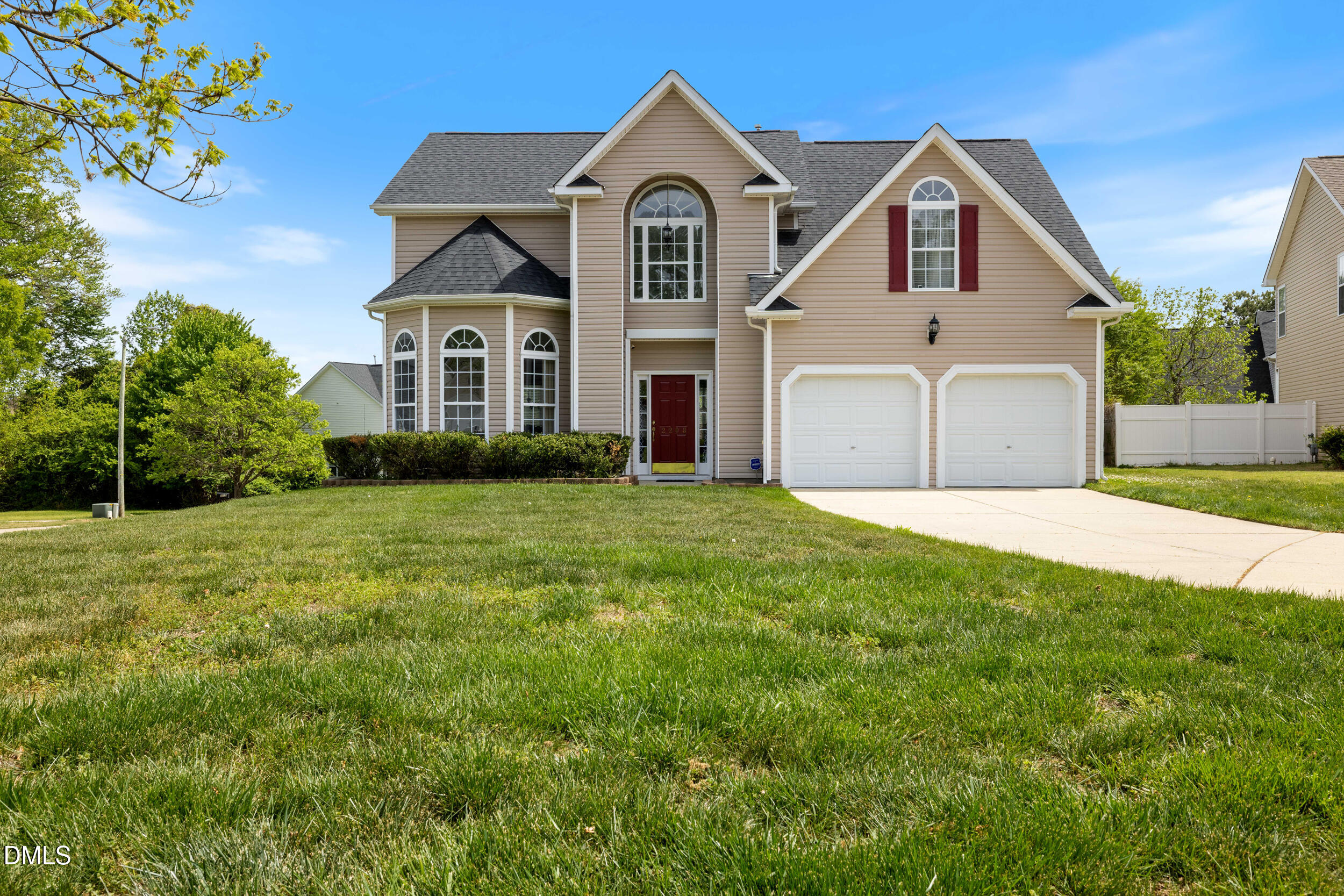 2208 Water Spray Drive Raleigh, NC 27610 - Photo 26 of 28 a view of a brick house with a big yard and large trees