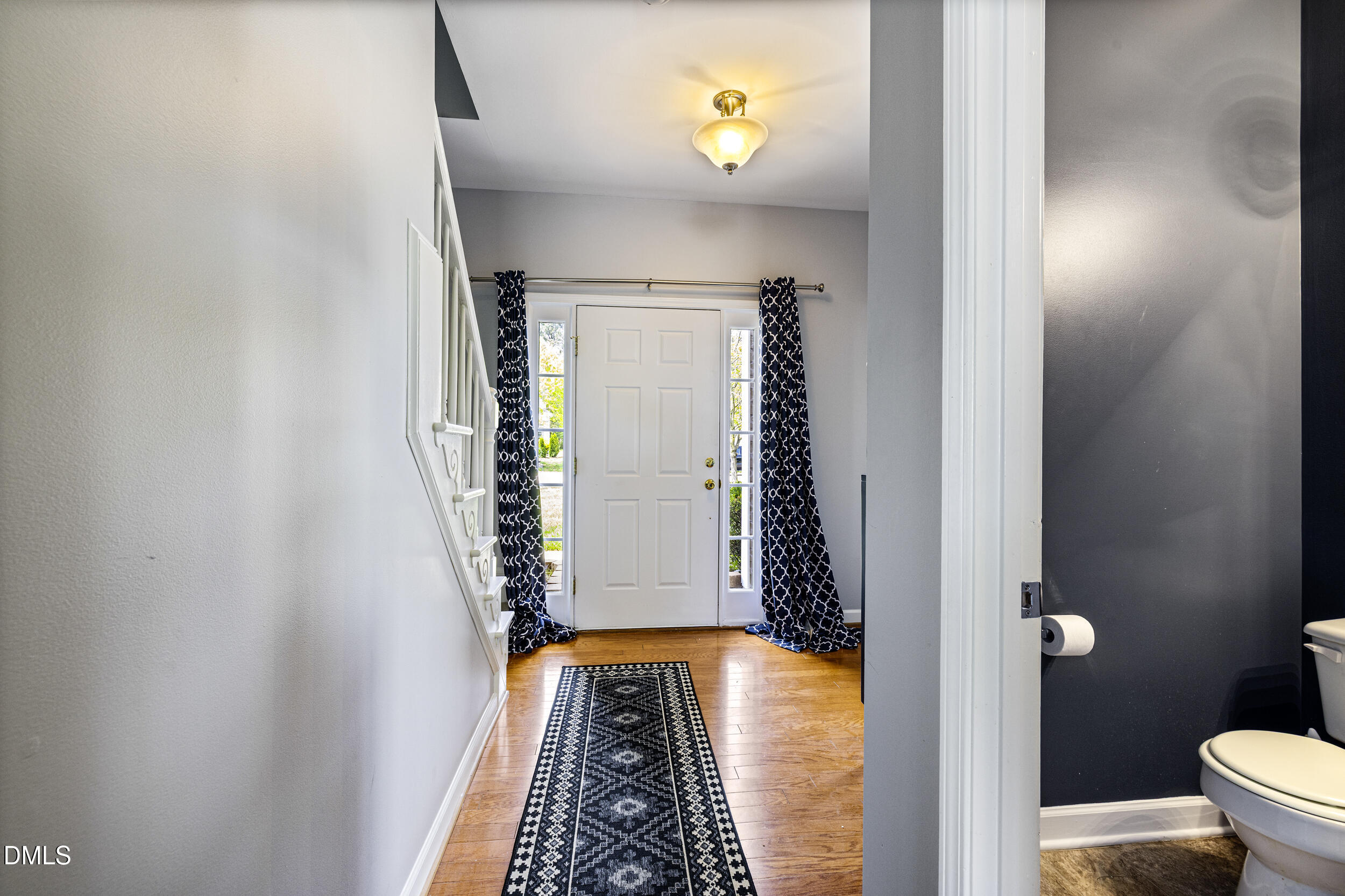 2208 Water Spray Drive Raleigh, NC 27610 - Photo 3 of 28 walk in closet with wooden floor in a bathroom