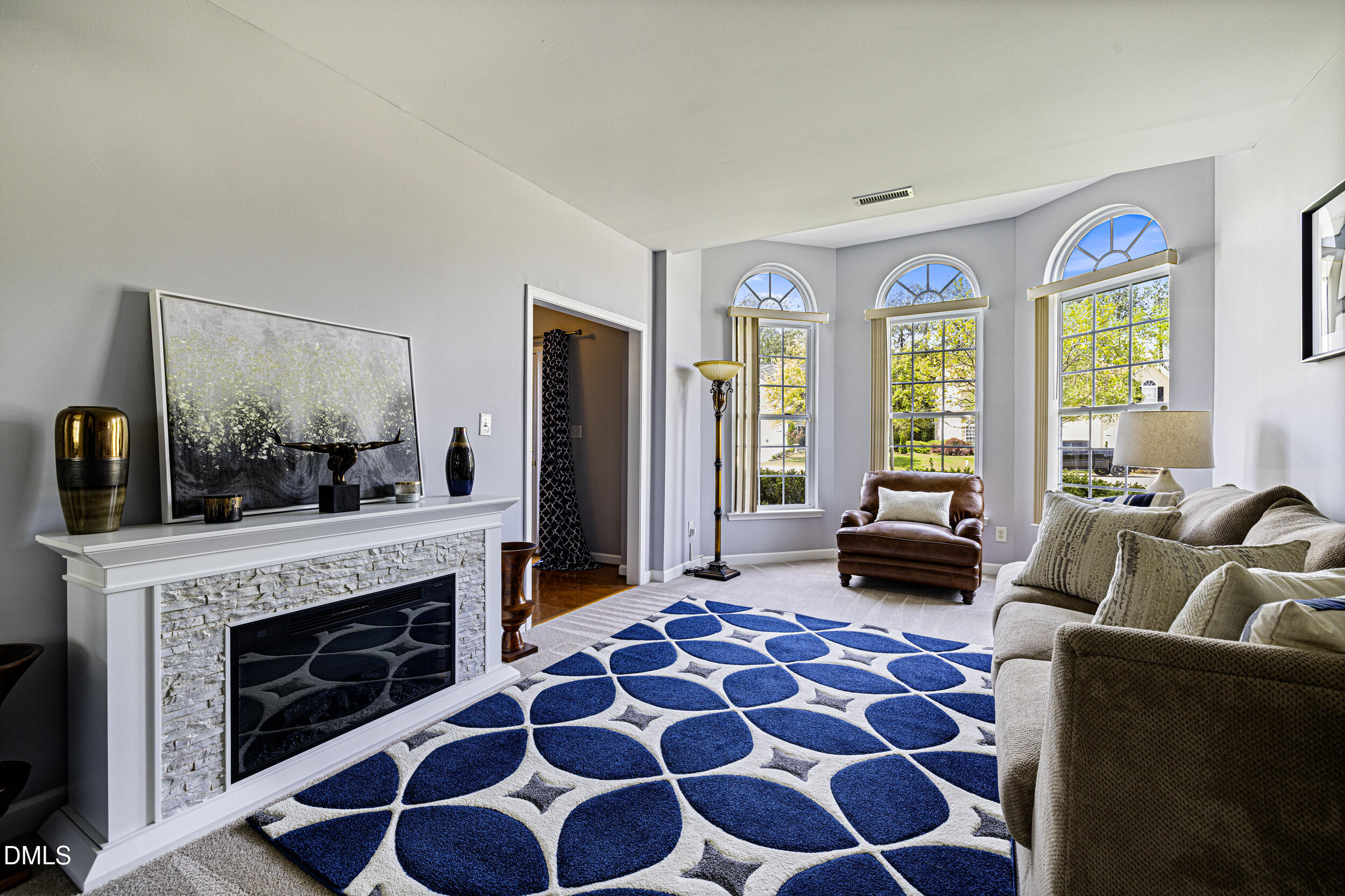 2208 Water Spray Drive Raleigh, NC 27610 - Photo 4 of 28 a living room with furniture and a fireplace
