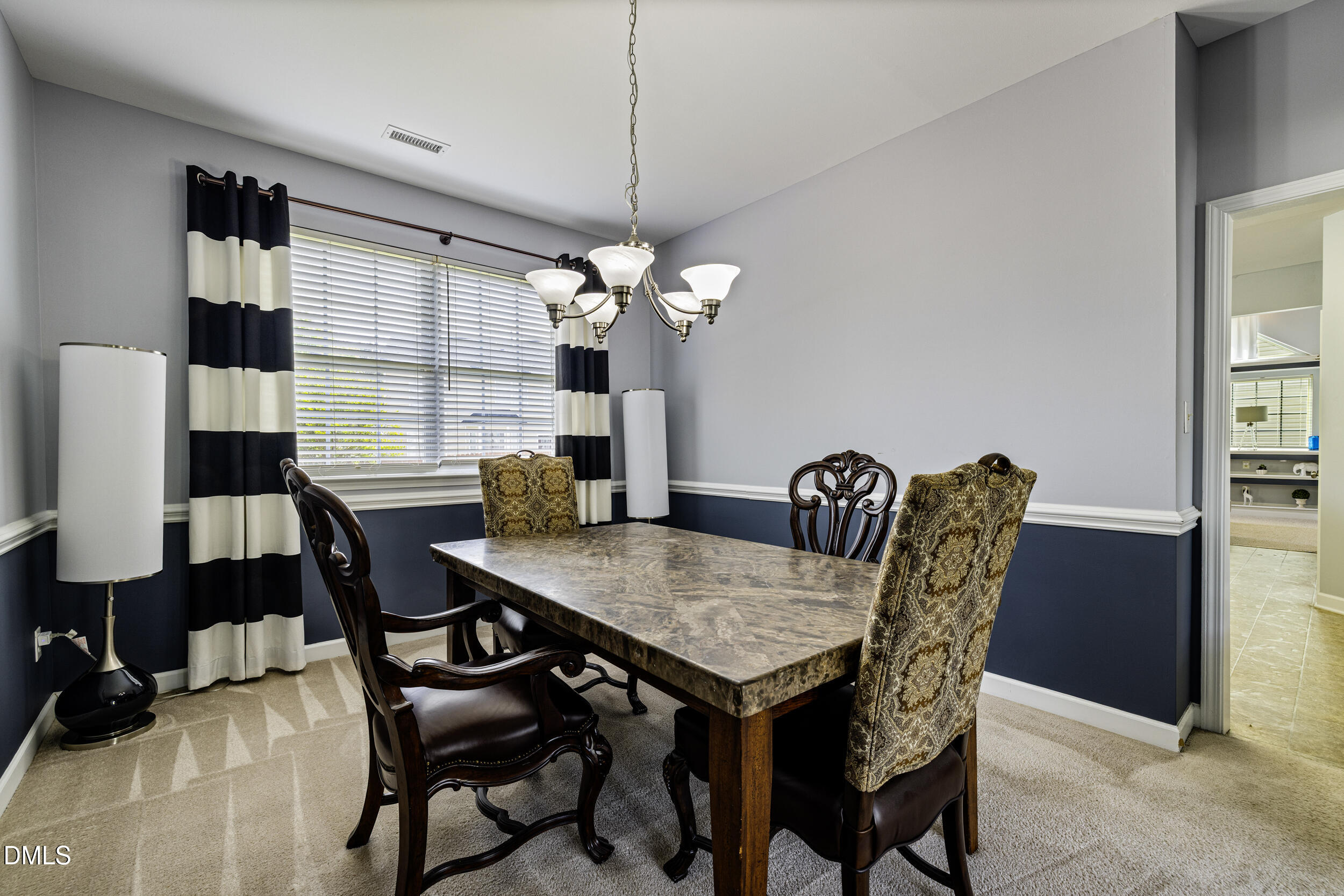 2208 Water Spray Drive Raleigh, NC 27610 - Photo 7 of 28 a view of a dining room with furniture and window