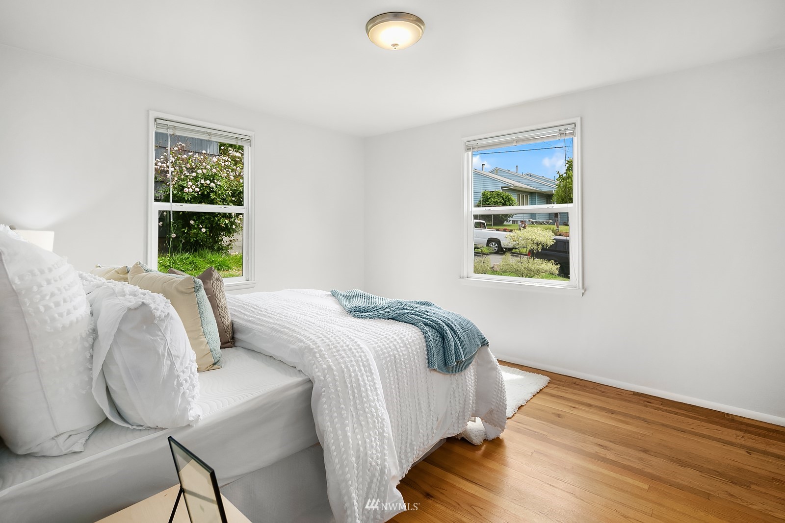 336 Northwest 47th Street Seattle, WA 98107 - Photo 13 of 36 a bedroom with a bed and a window