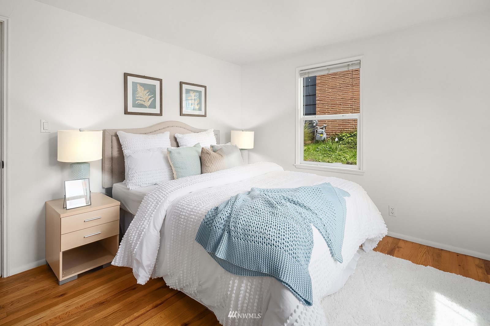 336 Northwest 47th Street Seattle, WA 98107 - Photo 14 of 36 a bed room with a bed and a night stand
