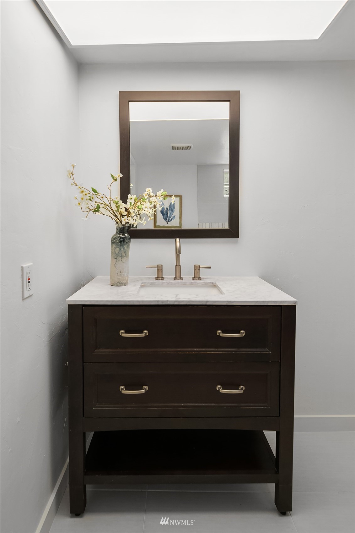 336 Northwest 47th Street Seattle, WA 98107 - Photo 20 of 36 a bathroom with a sink vanity and a mirror