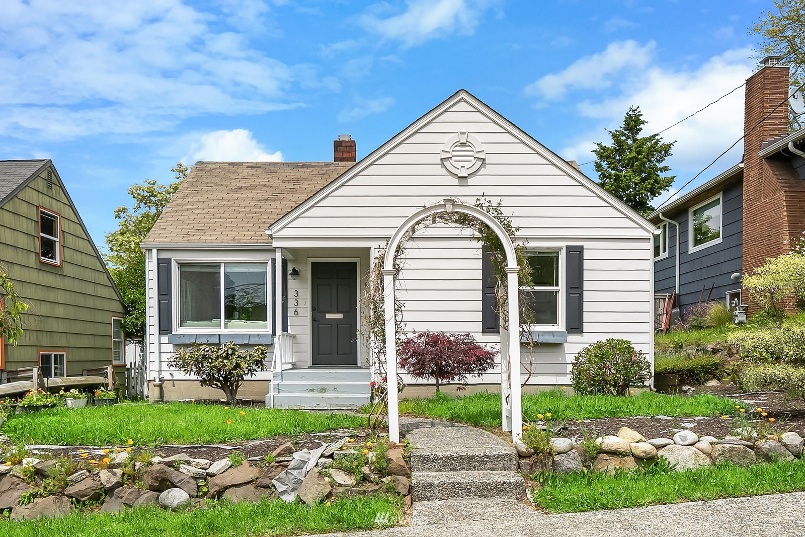 336 Northwest 47th Street Seattle, WA 98107 - Photo 2 of 36 a view of a house with a yard