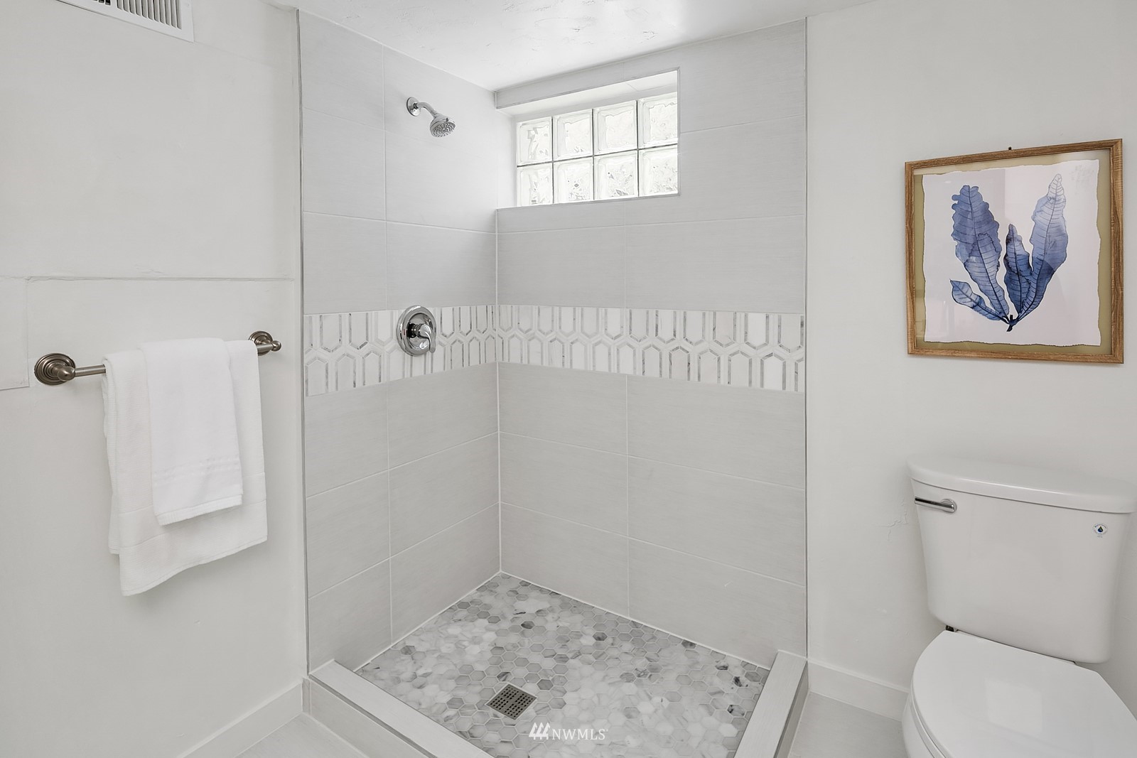 336 Northwest 47th Street Seattle, WA 98107 - Photo 21 of 36 a bathroom with a toilet and a shower