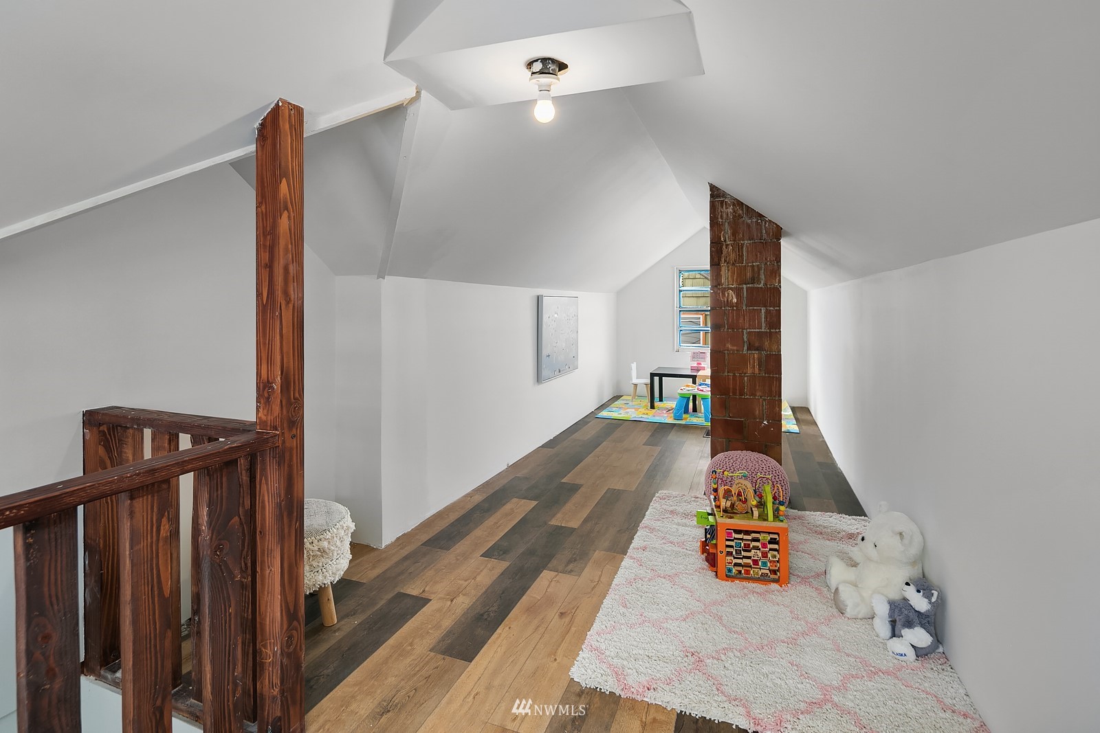 336 Northwest 47th Street Seattle, WA 98107 - Photo 24 of 36 a view of a hallway with wooden floor and stairs