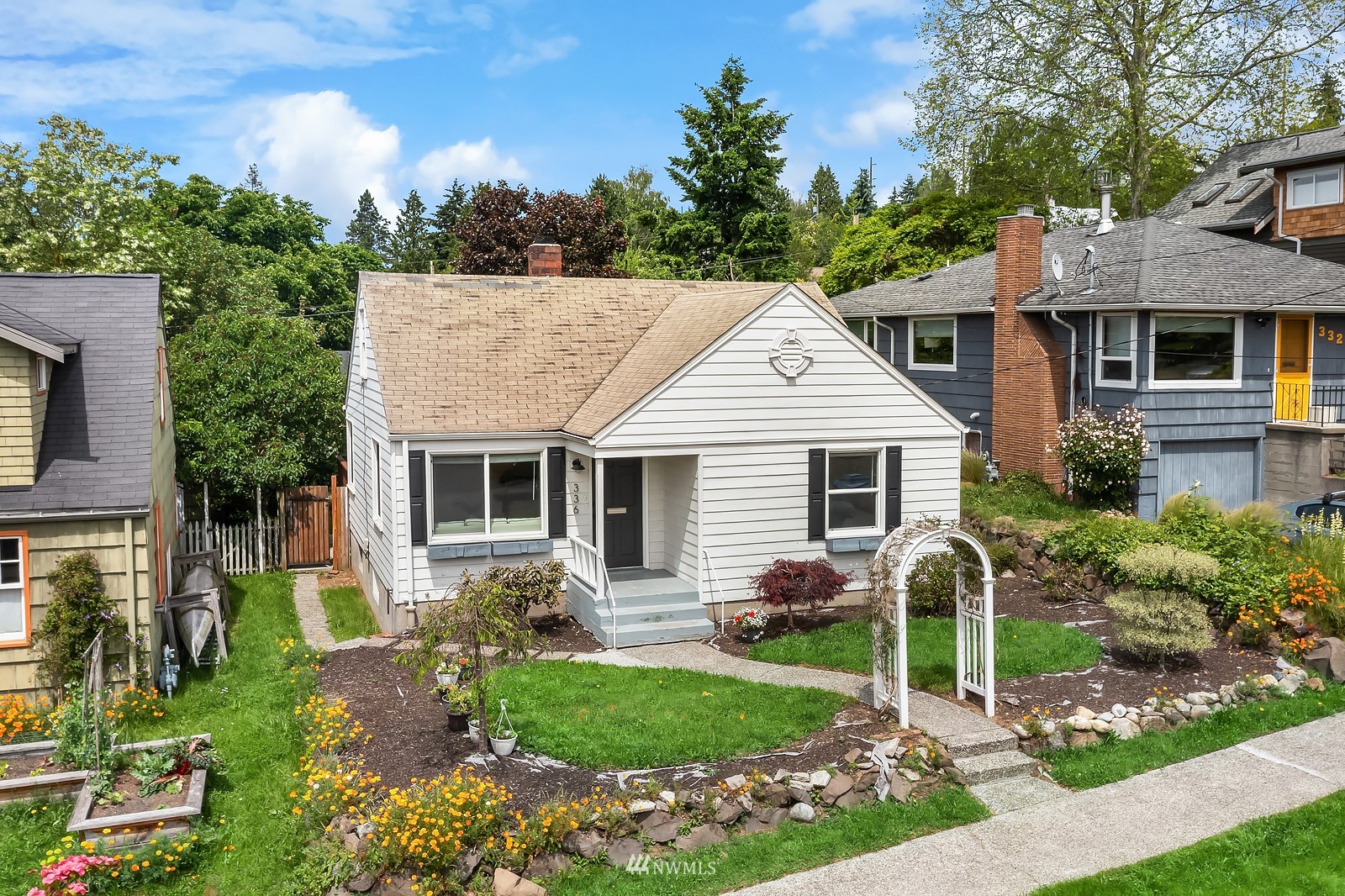 336 Northwest 47th Street Seattle, WA 98107 - Photo 31 of 36 a view of a house with a yard and plants
