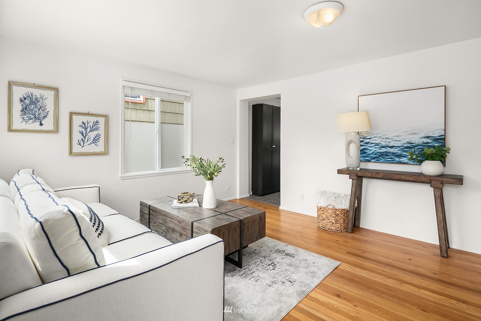 336 Northwest 47th Street Seattle, WA 98107 - Photo 5 of 36 a living room with furniture and a potted plant