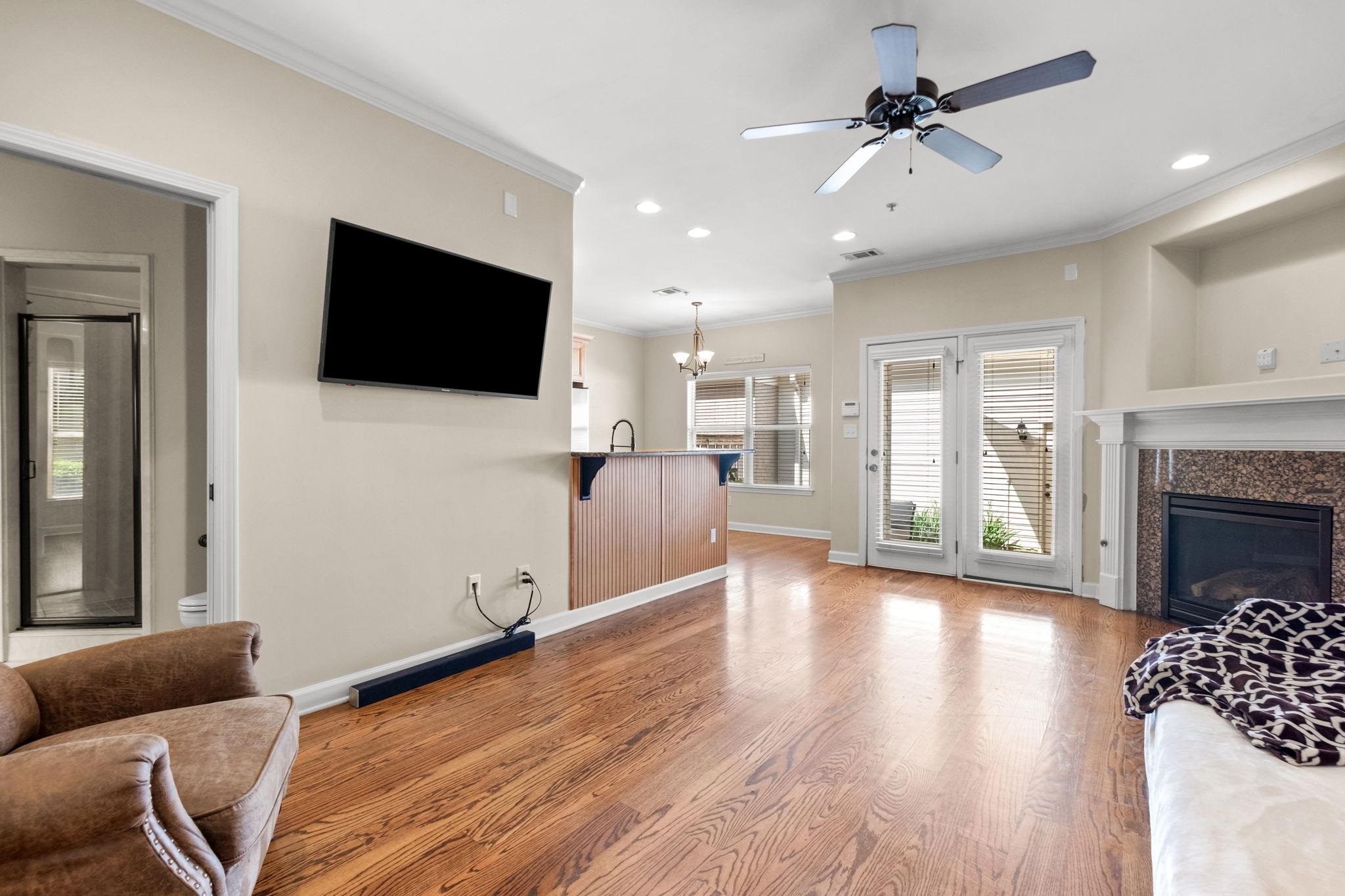 2275 McVay Road, Unit 2275 Germantown, TN 38138 - Photo 11 of 40 a living room with furniture and a flat screen tv