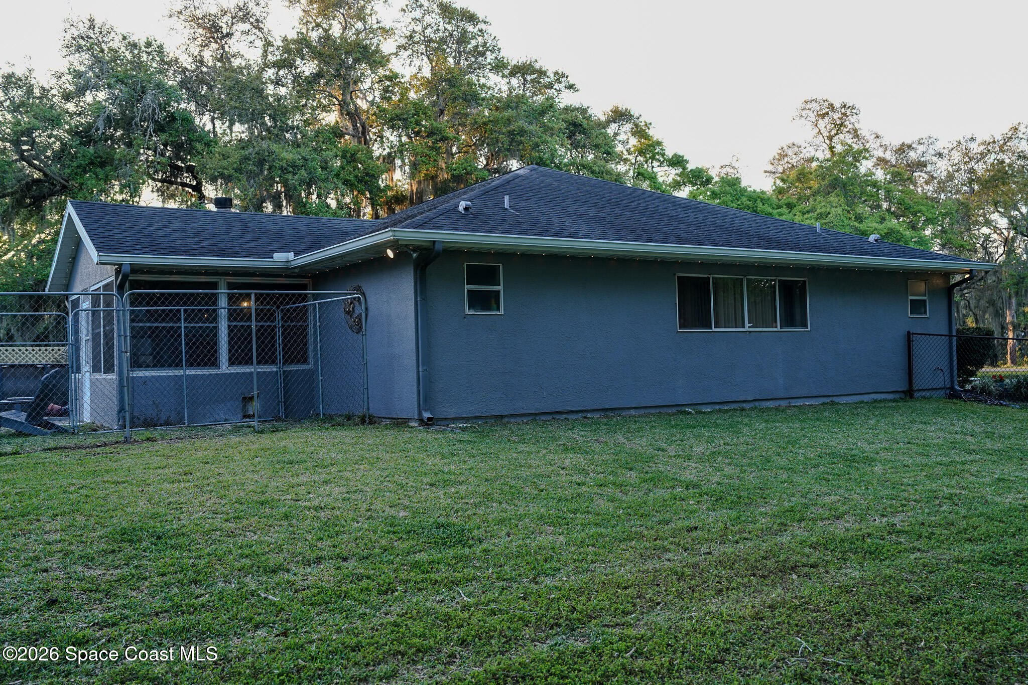 1265 Pine Island Road Merritt Island, FL 32953 - Photo 17 of 20 a backyard of a house with lots of green space
