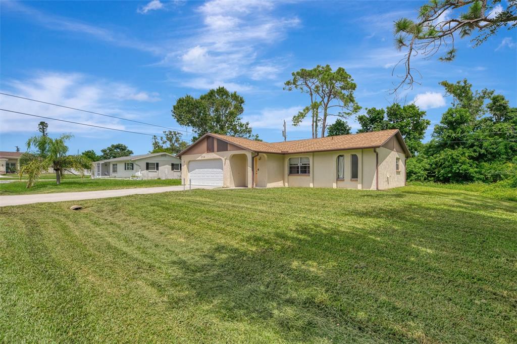 3716 Dunbar Road Venice, FL 34293 - Photo 1 of 1 a front view of a house with garden