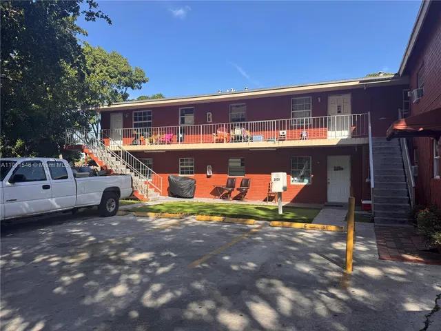 a view of a street with cars on the road