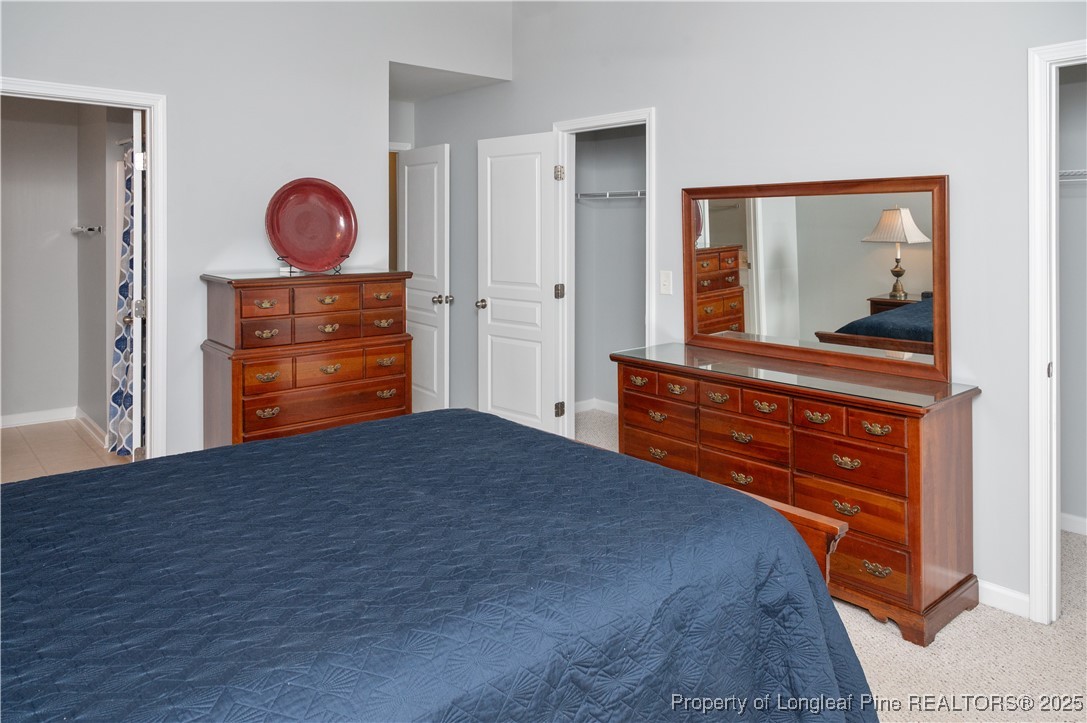 5229 Moonview Court Raleigh, NC 27606 - Photo 19 of 38 a bedroom with a bed and a dresser